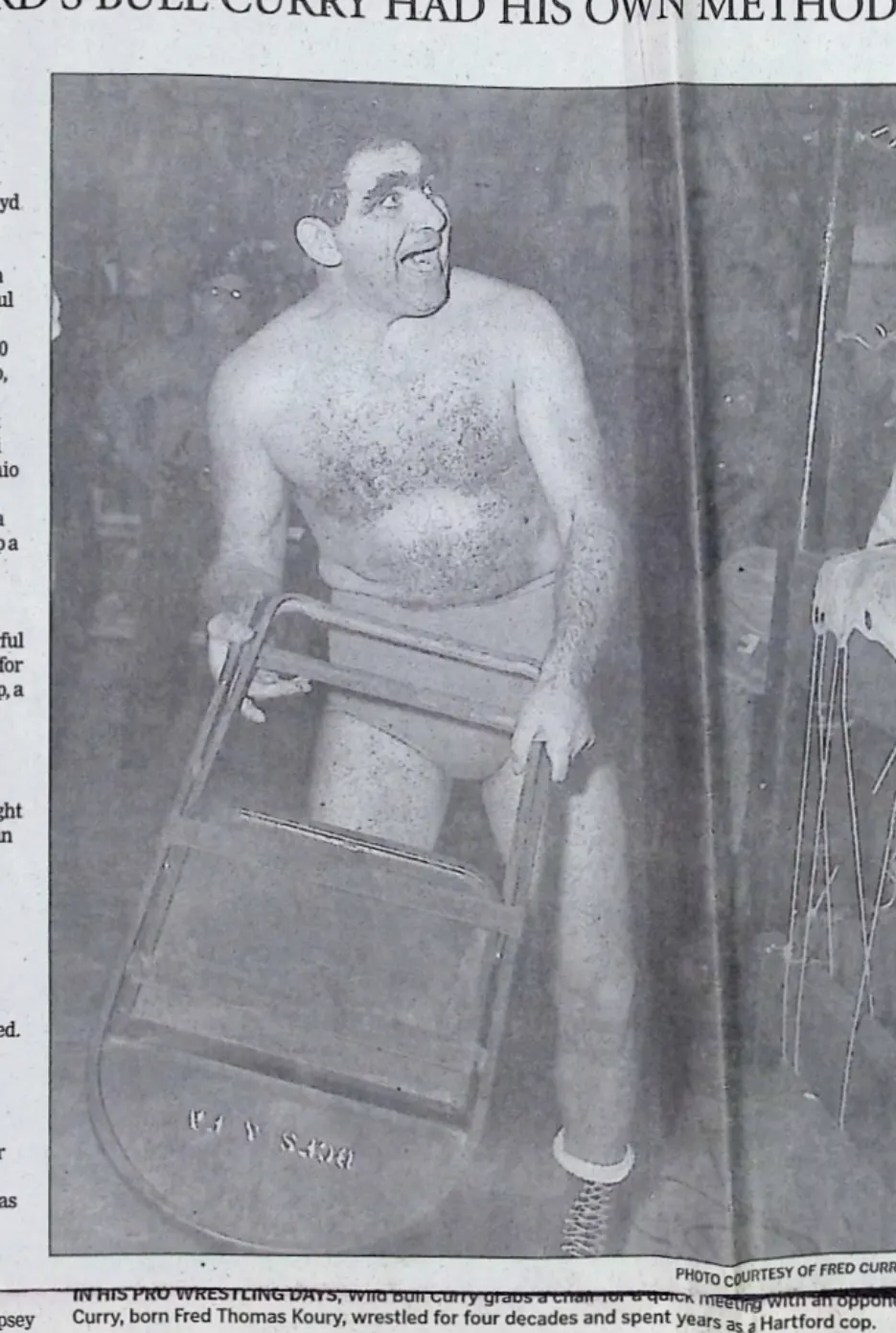 Hartford Courant 2008 photo of Bull Curry in the ring holding a folding chair, printed caption calls it a quick meeting with an opponent